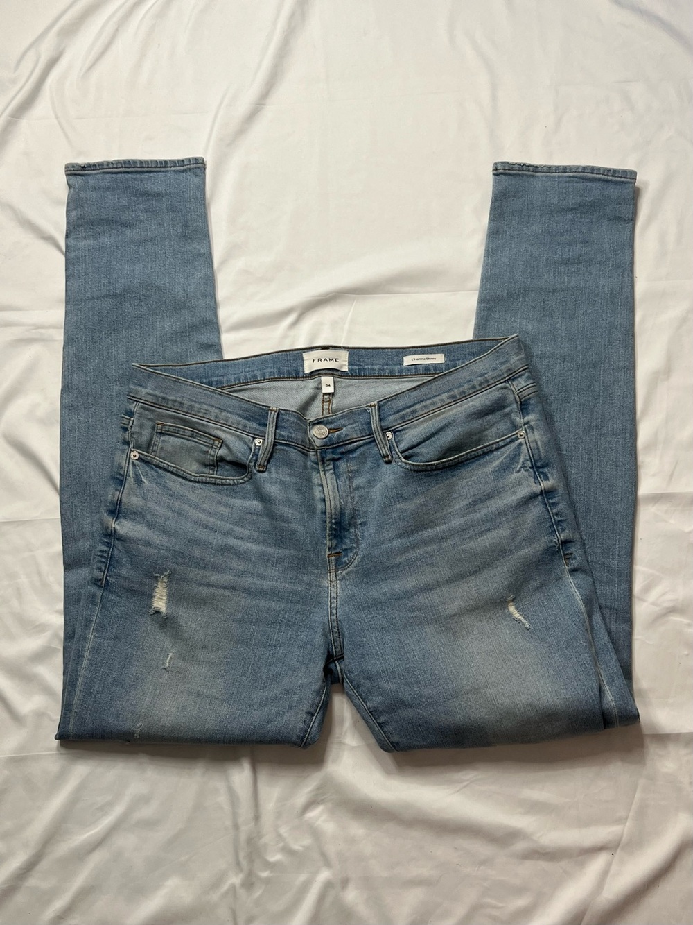 Frame Denim Light Blue Skinny Jeans with Subtle Distress
